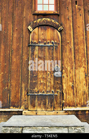 closeup of old wooden church entrance, historical building Stock Photo