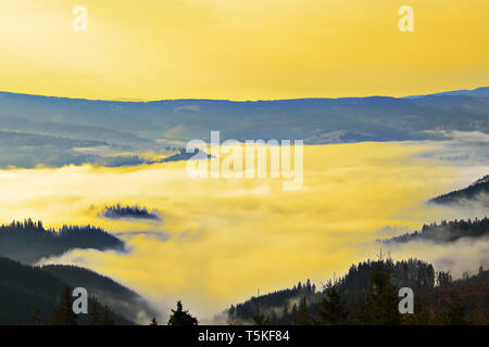 foggy morning in Carpathian mountains, beautiful landscape before sunrise Stock Photo