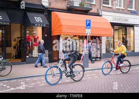 Cyclists ride shared blue-tired bikes Swapfiets Bicycle in Amsterdam, Netherlands, on Saturday, April 6, 2019.  (CTK Photo/ Libor Sojka) Stock Photo