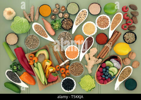 Healthy food for liver detox concept with fruit, vegetables, legumes, grains, seeds, herbs & spices used in herbal medicine & supplement powders. Stock Photo