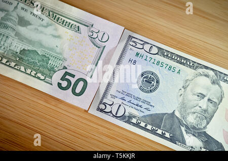 Closeup Of Fifty Dollar Bills On Wooden Table. Fifty Dollar Stock