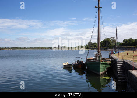 Fairy Queen and smaller boats at the quayside in Kinvarra, County Galway, Ireland Stock Photo