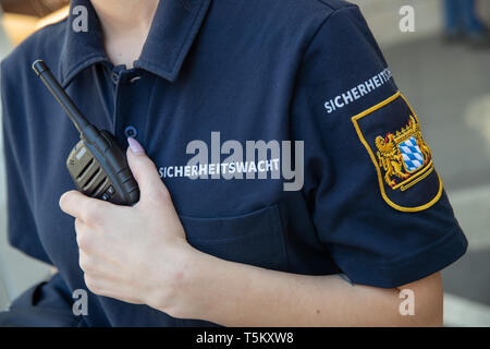 Nuremberg, Germany. 25th Apr, 2019. A member of the Bavarian security guard presents the new clothing and equipment. The volunteers receive neon yellow warning vests, flashlights and an improved pepper spray for their 25th anniversary. The new dark blue clothing of the security guard is modelled on the current Bavarian police uniforms. Credit: Daniel Karmann/dpa/Alamy Live News Stock Photo