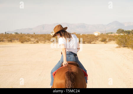 Woman Riding Horse Stock Photo