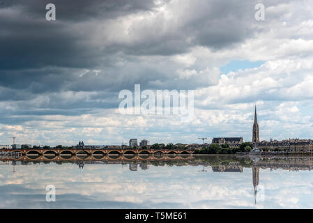 Cityscape of Bordeaux and reflection on water of Garonne River