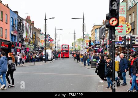 A crowded Camden Town high Street with tourists enjoying the colourful shops of the famous market, North London England UK Stock Photo