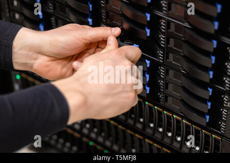 IT Professional Replacing Server Drive In Fiber San Storage Stock Photo