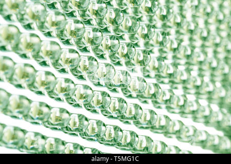 Straight rows of LEDs in the light panel close-up. Green neon shade. Green energy concept Stock Photo