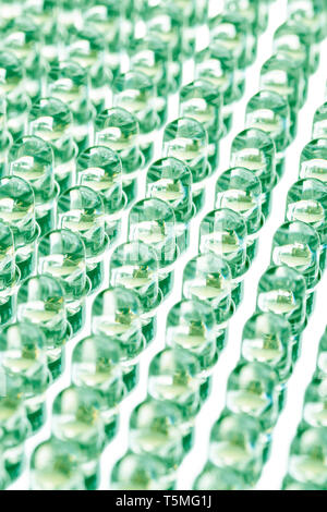 Straight rows of LEDs in the light panel close-up. Green neon shade. Green energy concept Stock Photo
