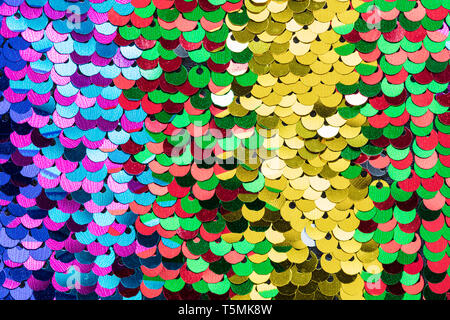 Multicolour Beautiful iridescent sequins texture, fish scale fabric background, close up Stock Photo