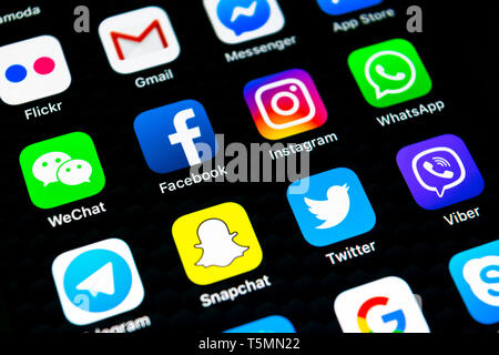 Sankt-Petersburg, Russia, February 16, 2019: Apple iPhone X with icons of social media facebook, instagram, twitter, snapchat application on screen. S Stock Photo