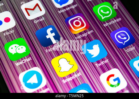 Sankt-Petersburg, Russia, February 16, 2019: Apple iPhone X with icons of social media facebook, instagram, twitter, snapchat application on screen. S Stock Photo