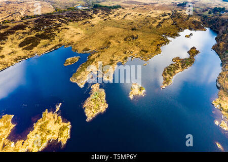 Aerial view of Lough Doon between Portnoo and Ardara which is famous for the medieval fort - County Donegal - Ireland. Stock Photo