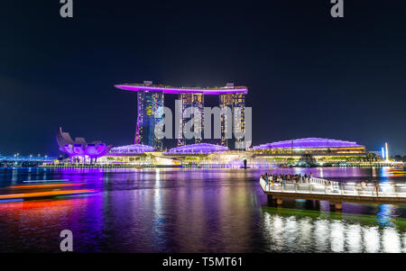 SINGAPORE - MARCH 24, 2019: Spectra - A Light and Water Show at Marina Bay Sands and the event Plaza is a free daily 15 minute show. Stock Photo