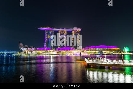 SINGAPORE - MARCH 24, 2019: Spectra - A Light and Water Show at Marina Bay Sands and the event Plaza is a free daily 15 minute show. Stock Photo