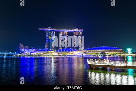 SINGAPORE - MARCH 24, 2019: Spectra - A Light and Water Show at Marina Bay Sands and the event Plaza is a free daily 15 minute show. Stock Photo