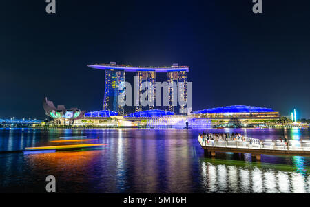 SINGAPORE - MARCH 24, 2019: Spectra - A Light and Water Show at Marina Bay Sands and the event Plaza is a free daily 15 minute show. Stock Photo