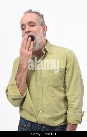 man yawning on white background Stock Photo