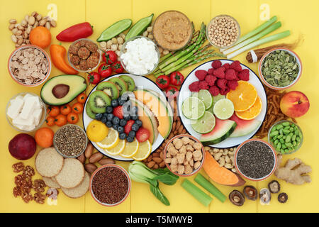 Vegan health food for a healthy life concept with a large super food collection. Healthy foods high in protein, omega 3, antioxidants & vitamins. Stock Photo