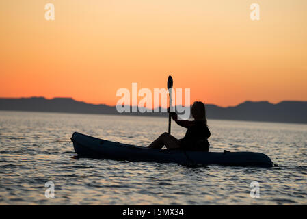 Kayaking at sunset, Espiritu Santo Island, Baja California Sur, Mexico. Stock Photo