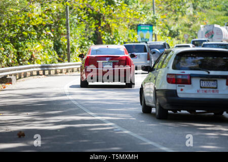 Ocho Rios, St. Ann / Jamaica - February 2019: Cars are seen in traffic heading into Oho Rios town centre. Stock Photo