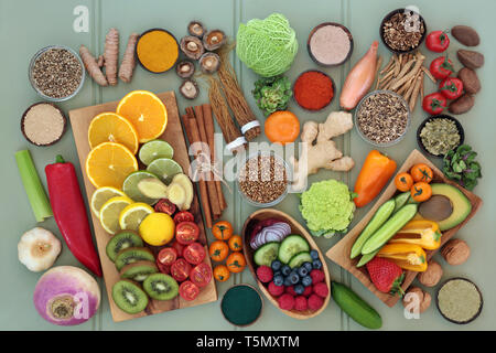 Health food for liver detox concept with fresh fruit, vegetables, nuts, seeds, supplement powders with herbs and spices used in herbal medicine. Stock Photo