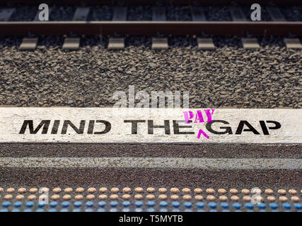 Pay gap, Mind the pay gap graffiti in pink, Gender pay equality concept – Image Stock Photo