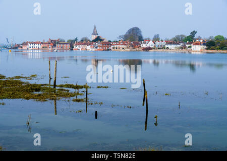 View to pretty old village across Bosham Creek at high tide in Chichester harbour. Bosham, West Sussex, England, UK, Britain Stock Photo