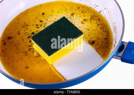 Sponge in clean a frying pan - isolated Stock Photo