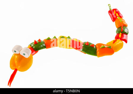 Bell pepper - snake. Snake carved from bell pepper. Stock Photo