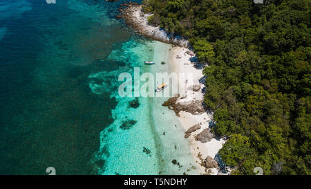 Tropical scenery aerial view in Malaysia. Perfect white sand, palm trees with turquoise water Stock Photo