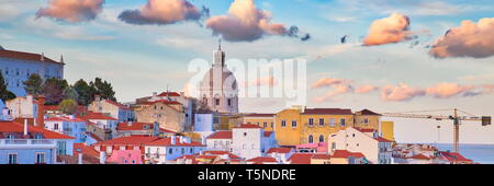 Scenic Alfama lookout with San Vicente (Saint Vincent) statue and Sao Vicente de Fora a church on the background Stock Photo