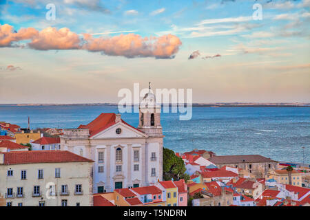 Scenic Alfama lookout with San Vicente (Saint Vincent) statue and Sao Vicente de Fora a church on the background Stock Photo