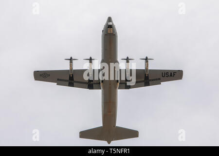 An Air Force C-130J Super Hercules assigned to 19th Airlift Wing, Little Rock Air Force Base, AR, flies over a runway at Fort Chaffee, AR during Operation Phantom Flight on April 12, 2019. Operation Phantom Flight is a joint service operation where both Soldier and Airmen worked alongside one another to successfully mobilize and transport Steel Warrior Battalions HIMARS from Henry Post Army Airfield, OK, to Fort Chaffee, AR, in order to successfully conduct an air/land raid. (U.S. Army photo by Sgt. Dustin D. Biven / 75th Field Artillery Brigade) Stock Photo