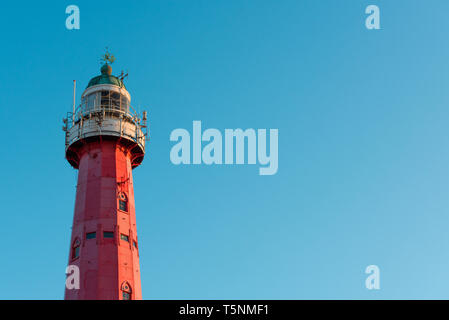 Vintage lighthouse over blue sky background and copy space Stock Photo