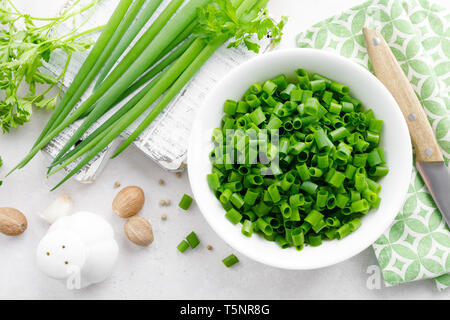 Fresh green onion sliced in bowl Stock Photo