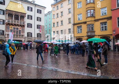 Innsbruck, Austria - October 27 2018: Famous street called Herzog-Friedrich-Straße on a rainy day with people sightseeing Stock Photo