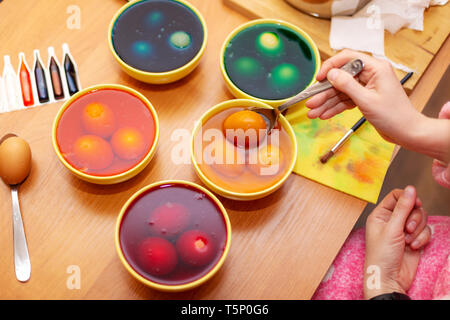 Person who painting easter eggs,  Dyed Easter eggs Stock Photo