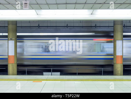 Motion blur side of high speed train in subway Stock Photo
