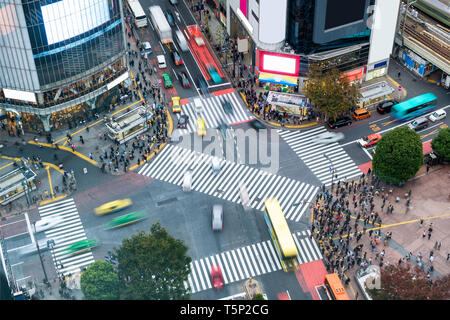 Aerial view of Pedestrians walking across with crowded traffic at Shibuya crossing square Stock Photo