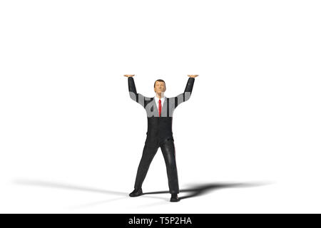 toy miniature businessman figure lifting an empty space, concept isolated on white background Stock Photo