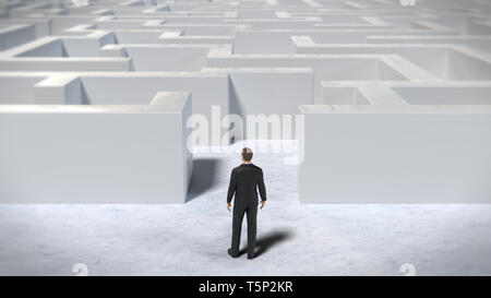 toy miniature businessman figurine entering a huge white maze structure Stock Photo