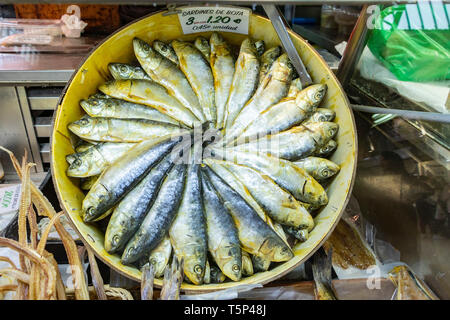 a display of Sardines de bota in a circular basket in Cntral Market Valencia Stock Photo