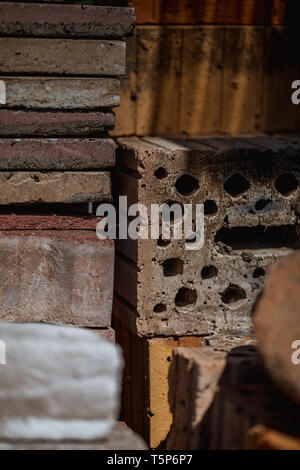 macro shot of old bricks stacked in the garden, close up Stock Photo