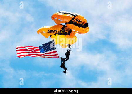 Wantagh, NY, United States - 26 May 2017: US Army paratroopers carrying the american flag open up the practice show for the air show. Stock Photo