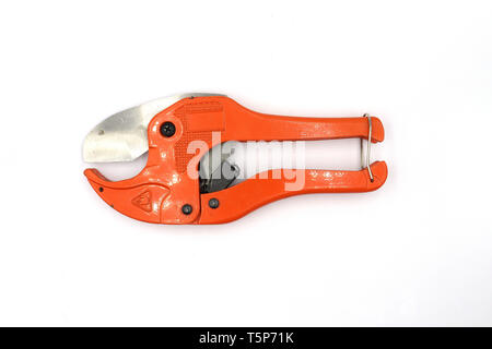 Red Pipe Cutting design, scissors for cutting plastic pipe isolated on white background High resolution image gallery. Stock Photo