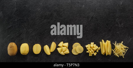 Different cuts of potatoes on a black textured background. Photo taken from above Stock Photo