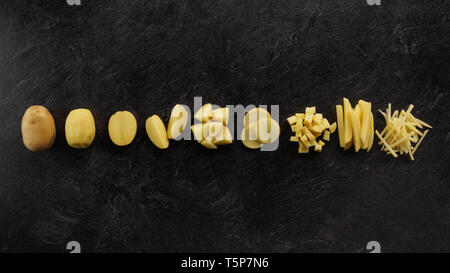 Different cuts of potatoes on a black textured background. Photo taken from above Stock Photo