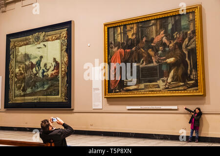 England, London, Knightsbridge, Victoria and Albert Museum, Interior View showing Father Photographing Daughter in Front of Artwork