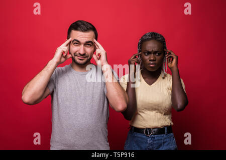 Young beautiful couple togheter over isolated background looking to ...